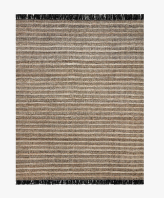 The Rey in Camel/Black - Holt x Palm -  Hand-woven of 100% polyester by artisans in India, the Rey Collection features new solids elevated by tonal texture. Created in collaboration with Justina Blakeney, the multi-colored yarn and stitching creates a natural striped effect, making no two pieces alike. 8 x 10