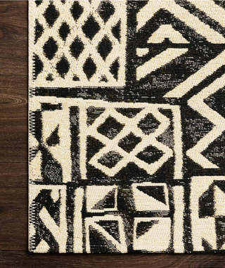 The Mika in Ivory/Black - Holt x Palm -  Bold Black and White graphics will make a statement in your space!Power-loomed of polypropylene and polyester in Egypt, the Mika Collection is a spectacular display of abstract and tribal-inspired designs. The textured yarn adds beautiful dimension and creates a truly unique look that is long-lasting and durable for outdoor and indoor spaces. Each piece is accented with a blanket-stitch finish. 7’.10” x 11’.2”