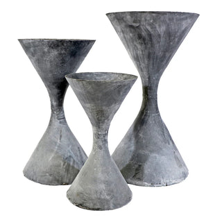 Spindle Planter - Holt x Palm -  This iconic hourglass shape was inspired by the original 1950's design by Willy Guhl, which was made of asbestos and woven concrete. Our reimagined version is crafted in cast iron for the best quality. Small: 14'' dia x 25'' Medium: 17½'' dia x 31½''Large: 21'' dia x 37''