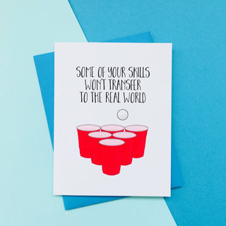 Beer Pong - Grad Skills Graduation Card - Holt x Palm -  This cheeky card is printed on high quality card stock that makes the ink really pop. It comes gift ready, with a fabulous envelope and a clear sheath. The card measures 4.25 x 5.5 inches and is blank inside.