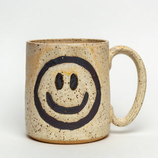 Smiley Face Handmade Mug - Holt x Palm -  This mug is hand-drawn and hand-glazed. This beautiful ivory mug with a smiley face hand-painted onto it is approximately 14 oz. Food, dishwasher, and microwave safe, It measures approximately 3 1/2 inches wide and 4 inches high. Each item is handmade and will vary from one to the next. No 2 pieces will be exactly the same. Colors may vary slightly. :-)