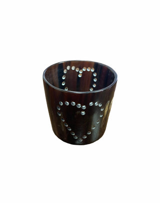 Horn Candle Luminary & Holder - Holt x Palm -  Handcrafted in Uganda, our horn candle luminary holder is pierced with a pattern of dots to let the light shine through. Polished for a shinny finish, the light of the candle reflects off the dotted designs that brightens your space with ambient light. Size: 1.5" by 2" wide