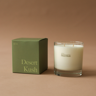 Desert Kush Candle - Holt x Palm -  Light up the 'DESERT KUSH CANDLE' for a scorching hot time. This clean burning, good smelling candle adds a hip and cool vibe to your space. Feel the heat (but in a good way)! Top Notes: Tangelo - Italian Bergamot Heart: Cannabis Flower - Cypress - Moss Base: Vetiver - Patchouli - Leather 8.5 ounces Burns 45 Hours All candles are Phthalate-free, using cotton wicks with no lead cores for safer, cleaner burning.